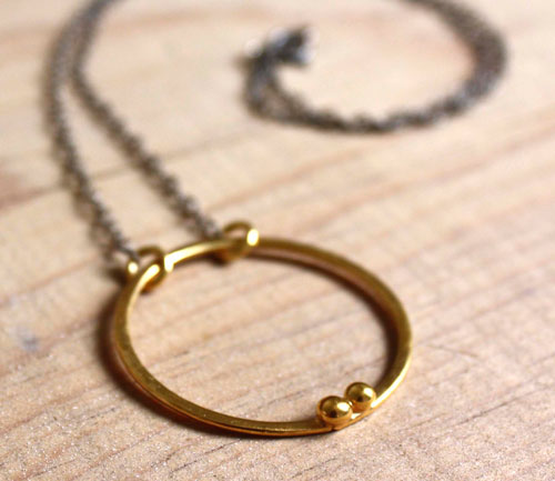 Gold enclosure, circle of the couple necklace in gold and sterling silver