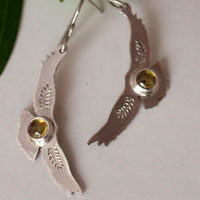Ode to the sun, bird earrings in sterling silver and yellow zircon