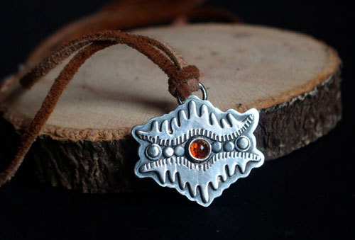 The eye of the earth, tribal mountain necklace in silver and amber