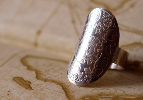 A time travel, steampunk clock and gear ring in sterling silver