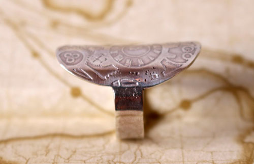 A time travel, steampunk clock and gear ring in sterling silver