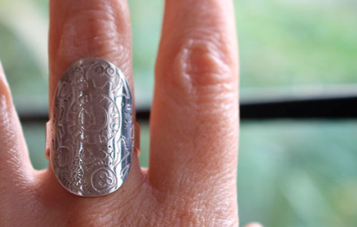 A time travel, steampunk clock and gear ring in sterling silver