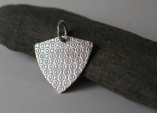 Crest, geometric guitar plectrum pendant in sterling silver