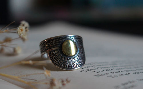 When the sun kisses the sea, astronomy ring in sterling silver and brass