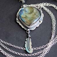 A bird left a feather at my window, elven necklace in silver and labradorite