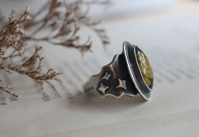 A rose under the stars, intaglio flower ring in silver and amber