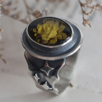 A rose under the stars, intaglio flower ring in silver and amber