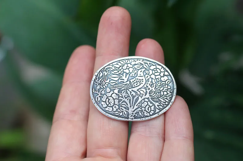 A song of hope, bird brooch in sterling silver