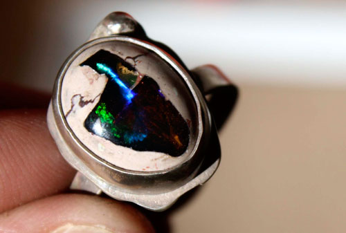 A thousand fires, a pyrotechnic spectacle ring in silver and fire opal