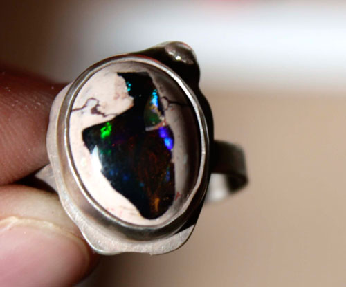 A thousand fires, a pyrotechnic spectacle ring in silver and fire opal