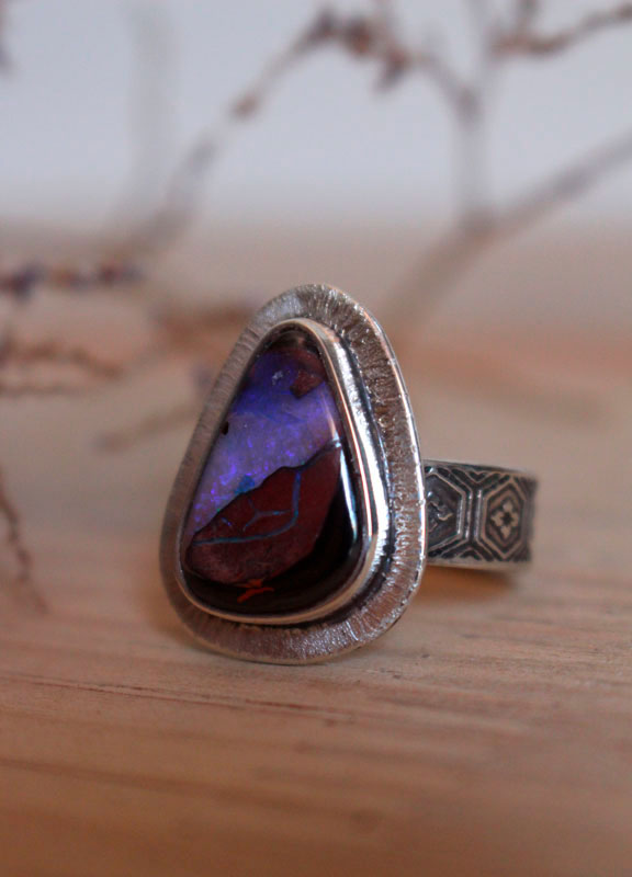 A world in balance, volcano ring in silver and boulder opal