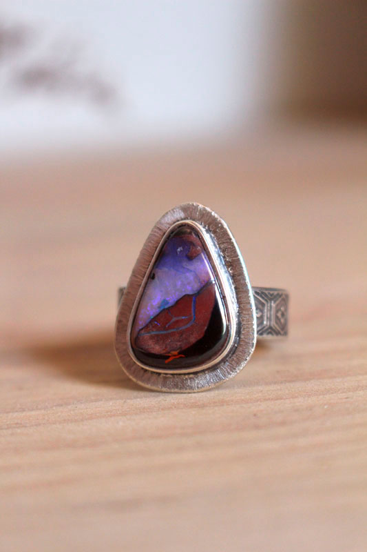 A world in balance, volcano ring in silver and boulder opal