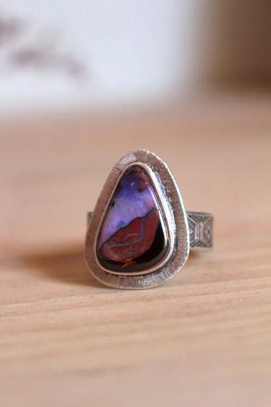 A world in balance, volcano ring in silver and boulder opal