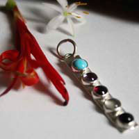 Anuha, family birthstone pendant in silver, turquoise, alexandrite, amethyst, garnet and aquamarine