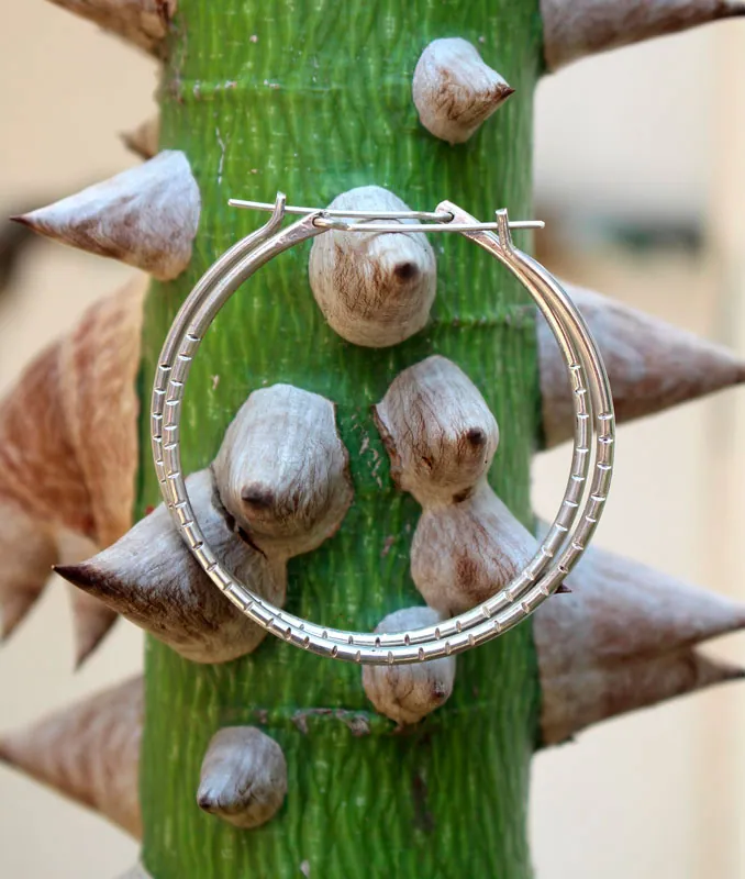 Aura, large stamped hoop earrings in silver