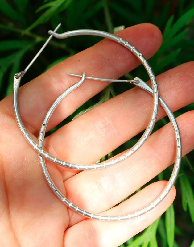 Aura, large stamped hoop earrings in silver