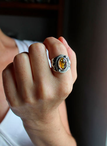 A halo in the darkness, sun ring in sterling silver and Baltic amber