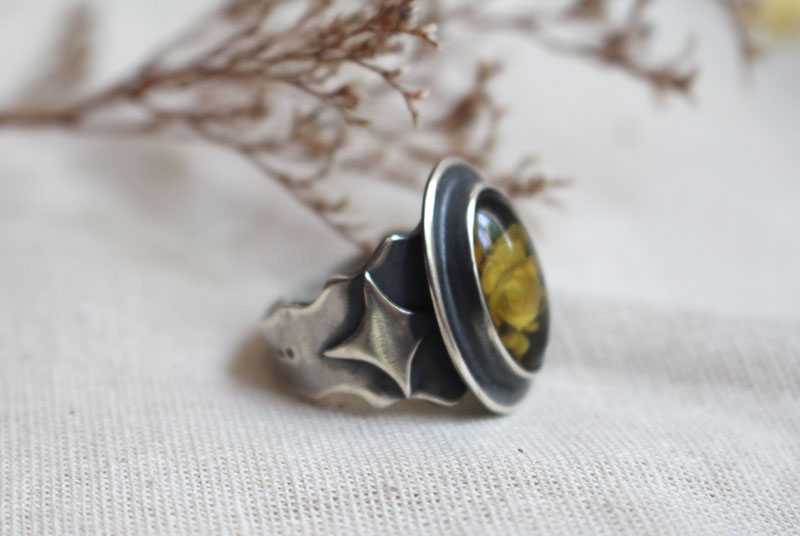 A rose under the stars, intaglio flower ring in silver and amber