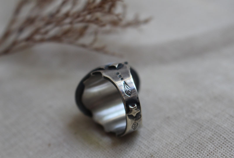 A rose under the stars, intaglio flower ring in silver and amber