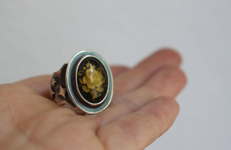 A rose under the stars, intaglio flower ring in silver and amber