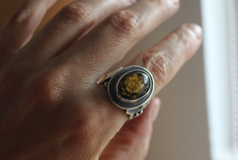 A rose under the stars, intaglio flower ring in silver and amber