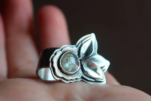 Blooming under the universe, flower and petals ring in silver and transparent sapphire
