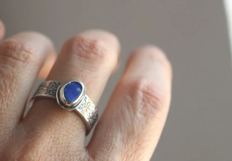 Blue iris, flower ring in silver and boulder opal