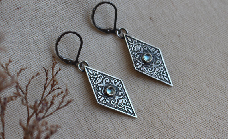 Belladonna, Renaissance floral earrings in silver and blue zircon