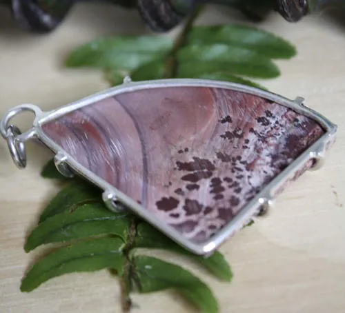 Chiricahua, Native American tribe pendant in silver and Apache rhyolite