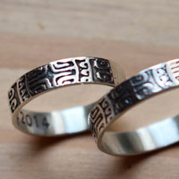 Diapason wedding bands, Polynesian symbol ring in silver