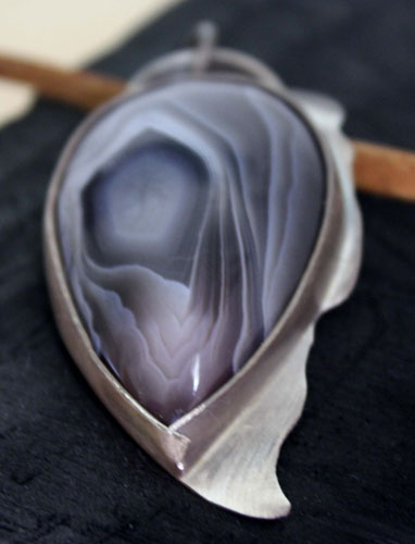 Eagle eye, raptor head pendant in silver and Botswana agate