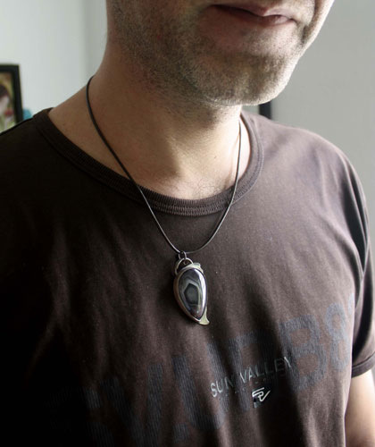 Eagle eye, raptor head pendant in silver and Botswana agate