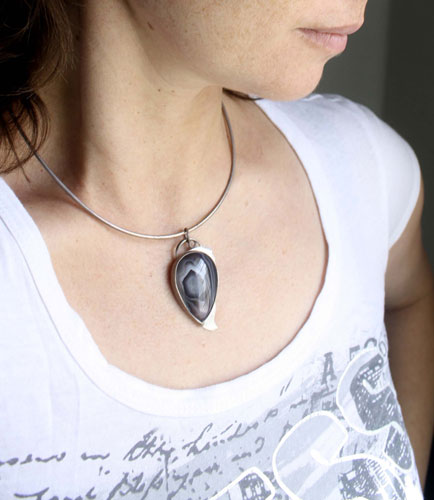 Eagle eye, raptor head pendant in silver and Botswana agate