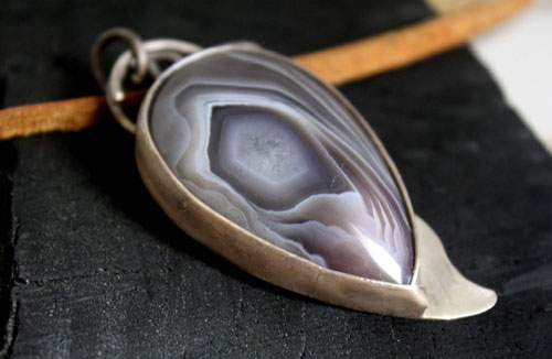 Eagle eye, raptor head pendant in silver and Botswana agate