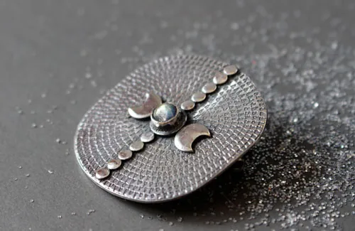 Equinox, moon and astronomy brooch in silver and labradorite