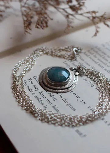 Eye of the sea, marine life necklace in silver and aquamarine