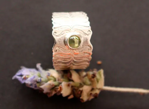 Fern flower, legendary from Eastern Europe ring in silver and peridot