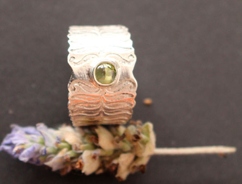Fern flower, legendary from Eastern Europe ring in silver and peridot