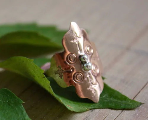 Fire rose, medieval rosette ring in silver and copper