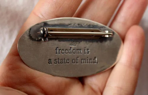 Freedom is a state of mind, bear and rabbit brooch in silver