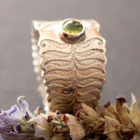 Fern flower, legend from Eastern Europe ring in sterling silver and peridot