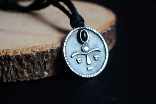 Gaia, African tribal mask necklace in silver and onyx