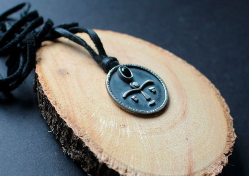 Gaia, African tribal mask necklace in silver and onyx