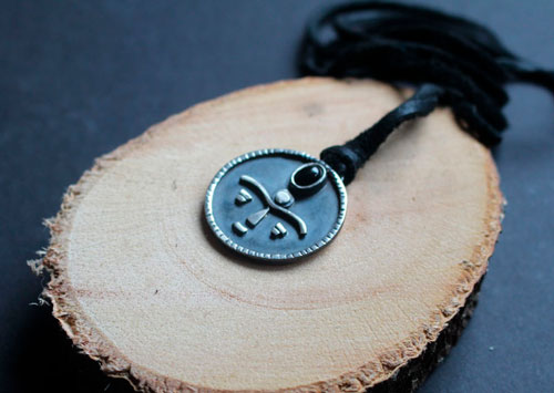Gaia, African tribal mask necklace in silver and onyx