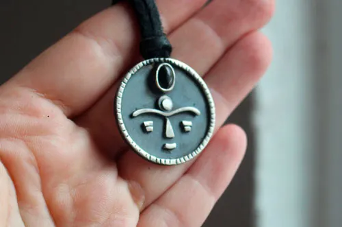 Gaia, African tribal mask necklace in silver and onyx