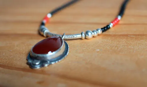 Garance, red dyer’s necklace in silver, coral, black agate and carnelian