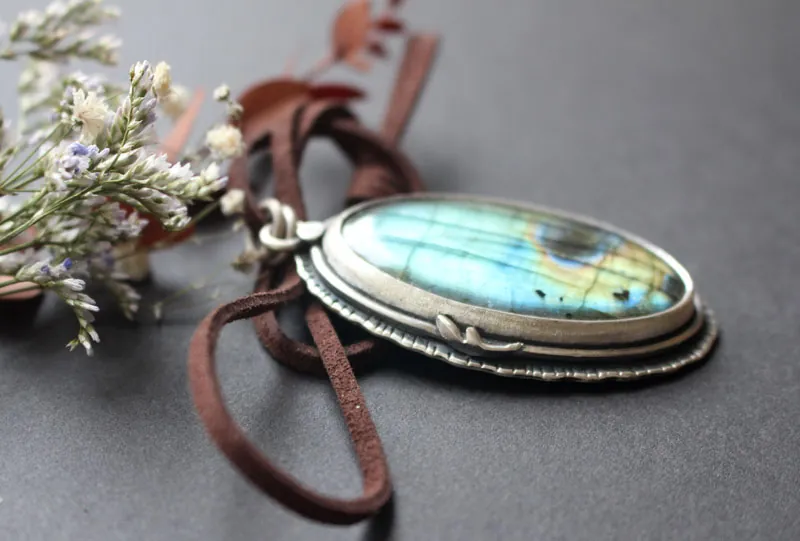 Heart of the forest, raven spirit pendant in silver and labradorite