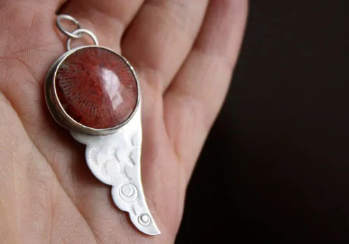 Hiko, japanese wing pendant in silver and red coral