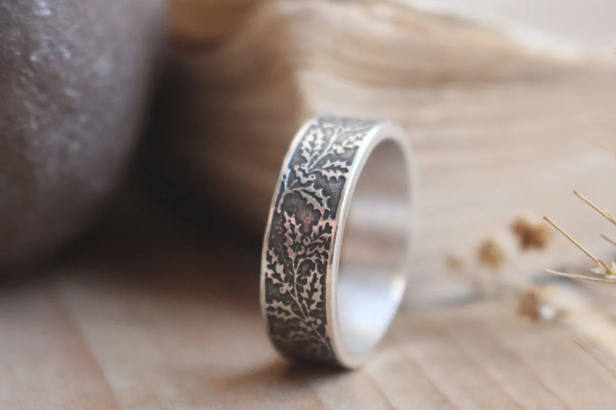 Holly, winter flower and berry ring in silver