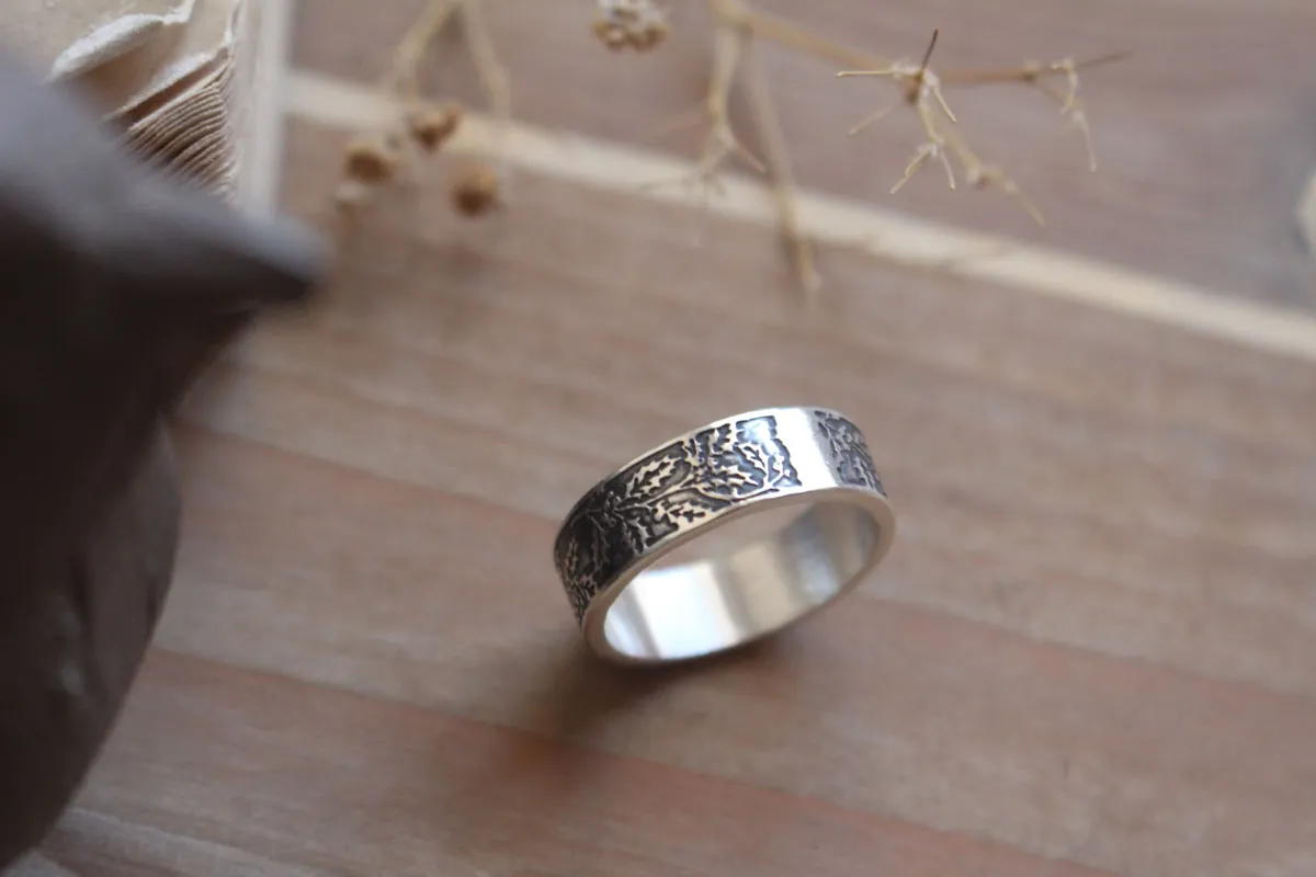 Holly, winter flower and berry ring in silver